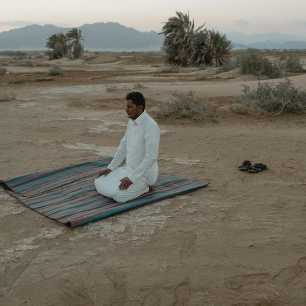 Person meditating in a calm environment, symbolizing inner peace.